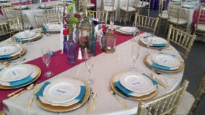 A table set up with plates and silverware.