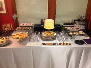 A dessert table with a variety of desserts on it.