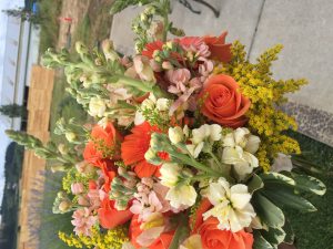 A bouquet of orange and yellow flowers.