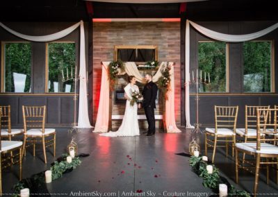 The bride and groom at the altar after the ceremony