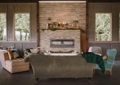 A lounge area with a fireplace for the guests