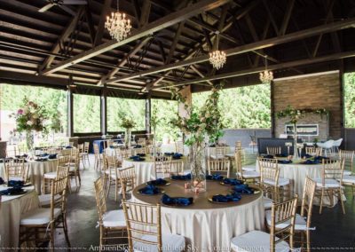 Dining tables and chairs inside the wedding hall