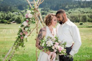 Newlyweds standing intimately