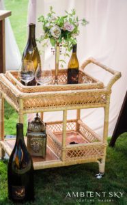 A cart with liquor and glasses