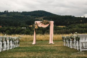 Flowers and cloth hanging from the arch