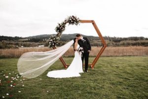 A bride and groom kiss