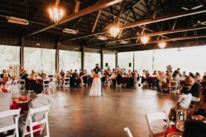 The bride and groom dancing intimately