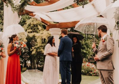 The wedding taking place under the rain