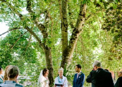 The wedding taking place under a tree