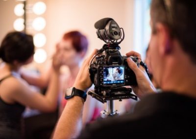 A photographer capturing event preparations