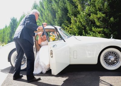 The bride stepping out of the car