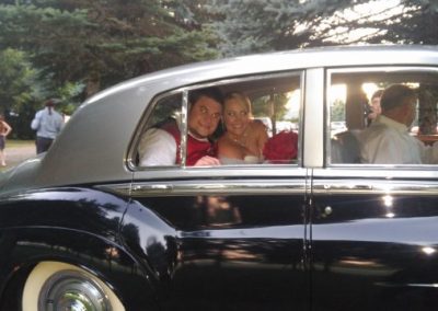 The newlyweds inside a car