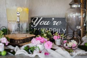 A table with flowers and a sign that says you're marry me.