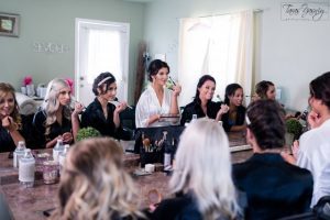 A group of bridesmaids sitting around a table.
