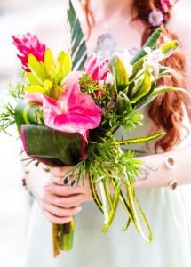 A woman holding a bouquet of flowers.