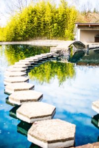 Stepping stones leading to a pool.