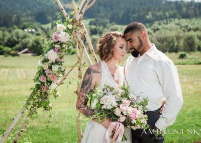 Newlyweds standing intimately