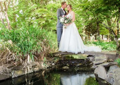 The groom kissing the forehead of his bride