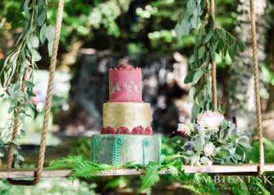 A tiered cake on a swing