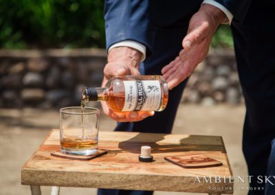 A man pouring liquor into the glass