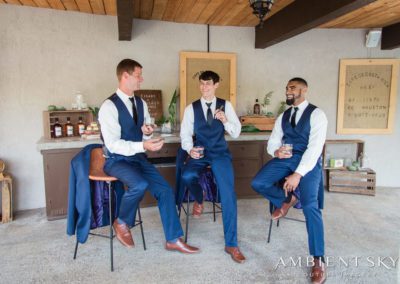 The groomsmen enjoying their drinks