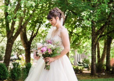 The bride looking at her flowers