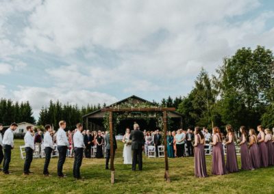 A view of the wedding from behind the arch