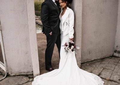 Bride standing next to her groom at an entrance