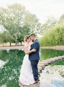 Newlyweds holding each other closely