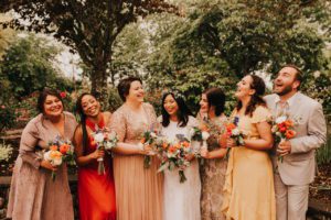 The bride and her attendants laughing