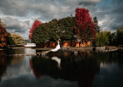 A view of the bride and groom across the pond